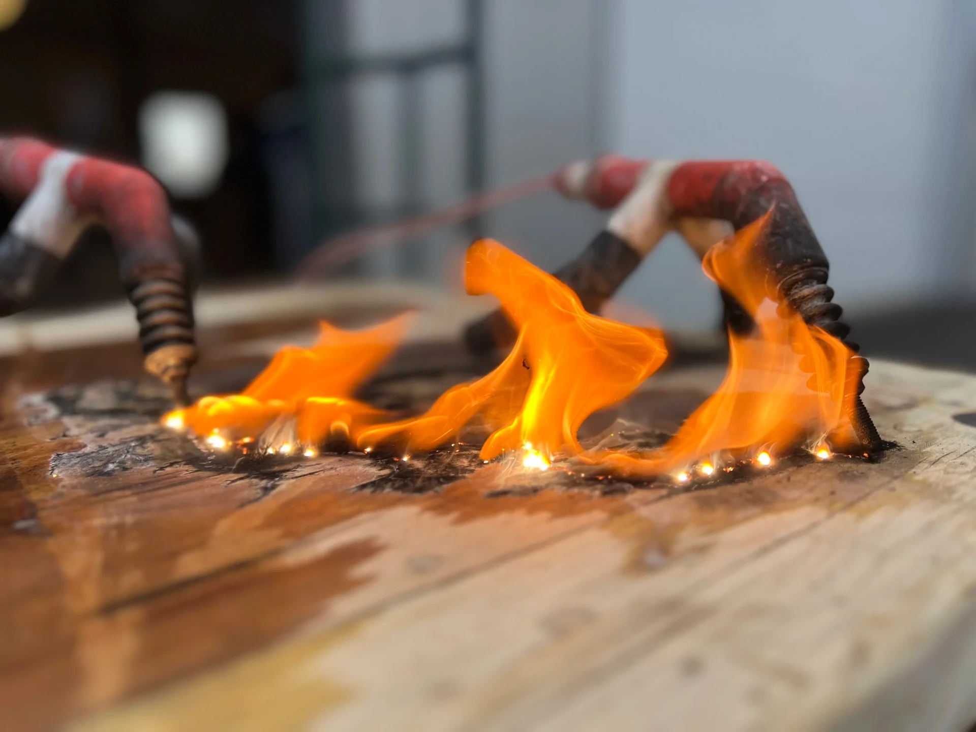 Master craftsman hand-finishing a piece of solid wood furniture